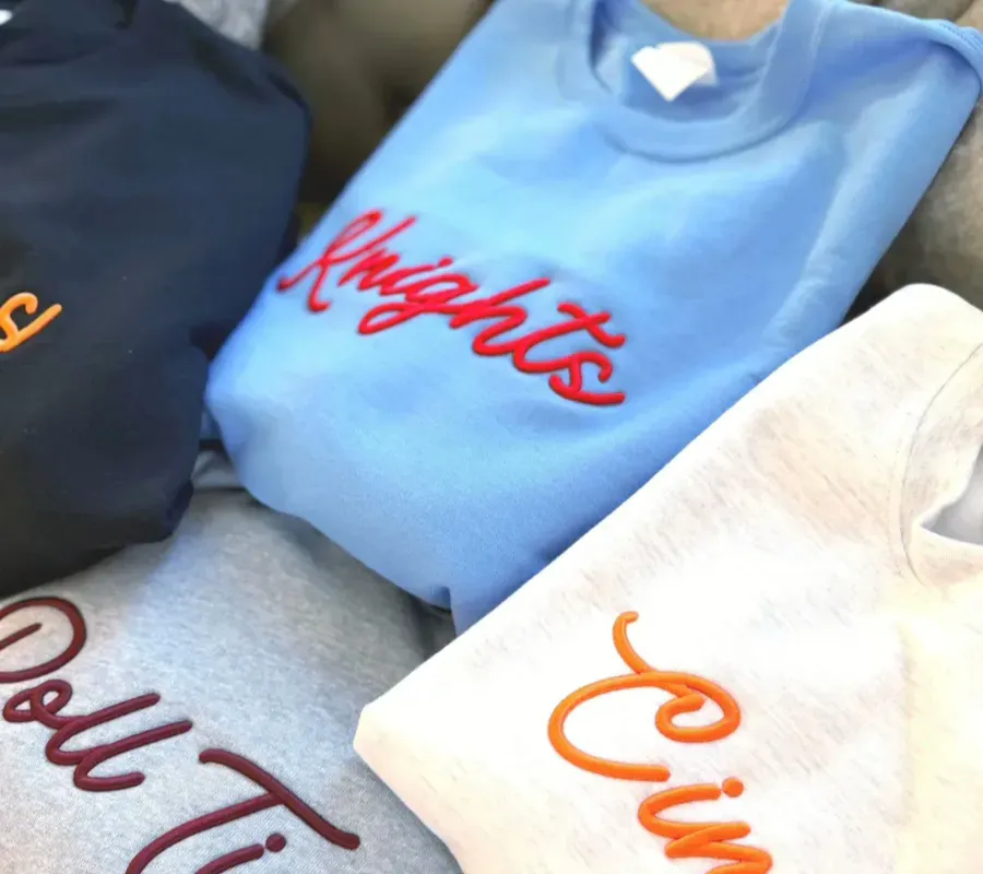 3D puff embroidery with raised dimensional effect on heavyweight sweatshirt fabric