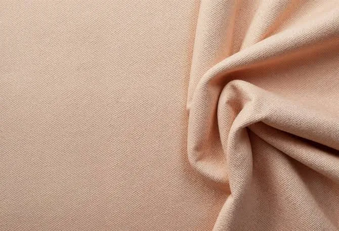 Peach-finish woven nylon with micro-abraded surface — virtually silent outer shell fabric for spot-and-stalk and close-quarters hunting