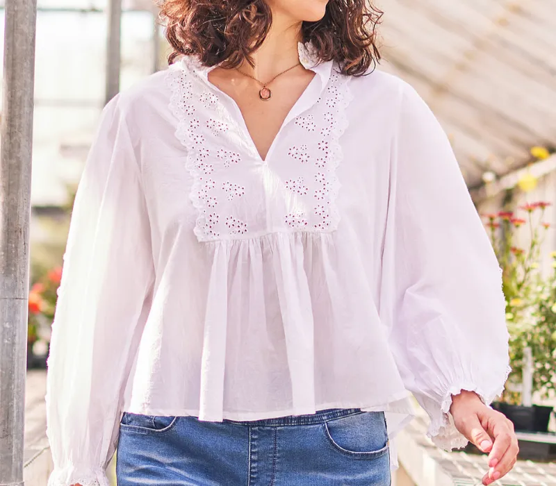 Blouse with a soft flowing drape and decorative detailing