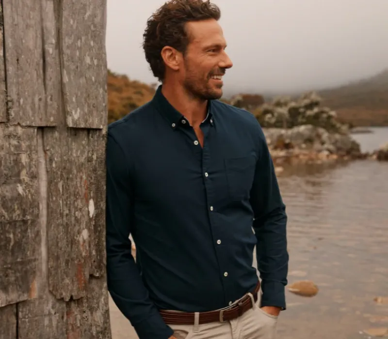 Button-down shirt with collar points fastened to the body