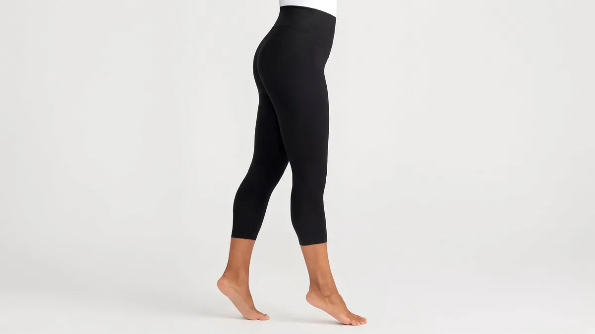 7/8 ankle-length yoga leggings worn by a model — custom activewear manufacturer