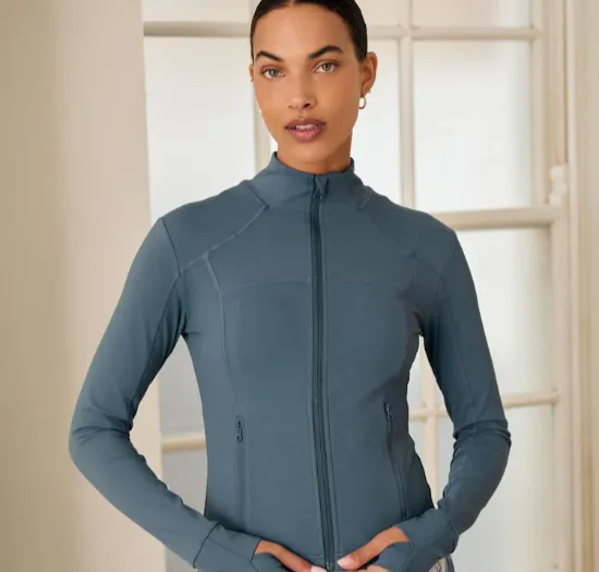 Custom lightweight packable yoga jackets with DWR finish and thumbhole cuffs — breathable studio-to-street layering piece