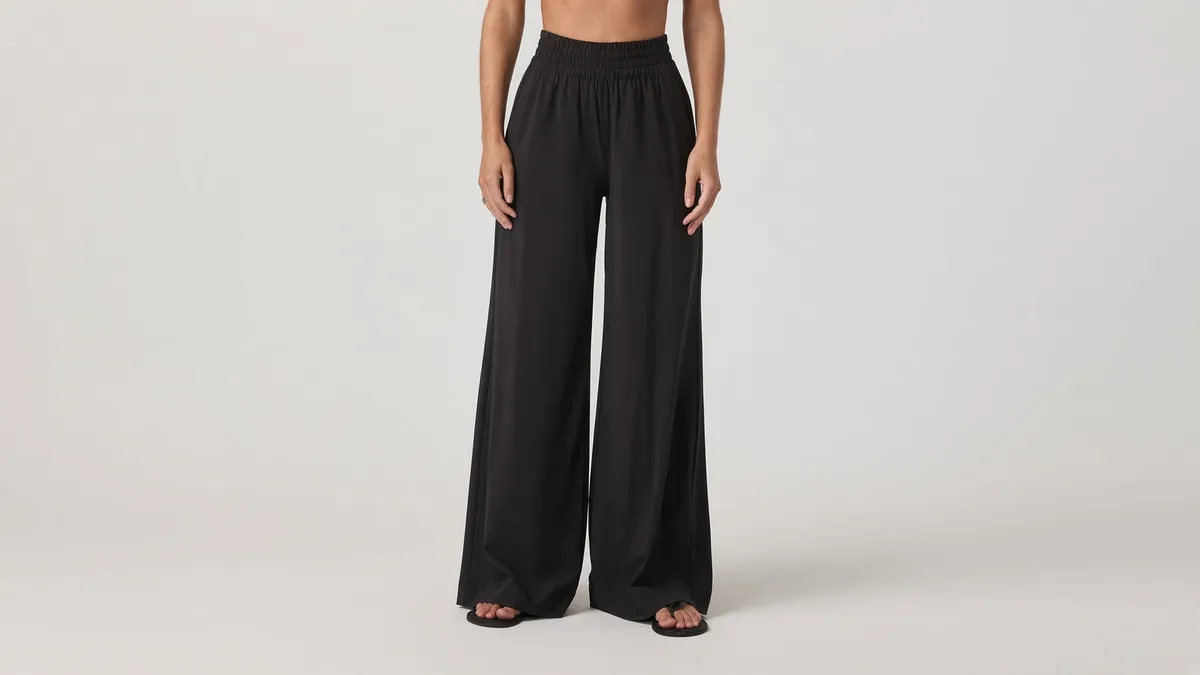 Wide-leg palazzo yoga pants in cream — loose flowing lounge silhouette