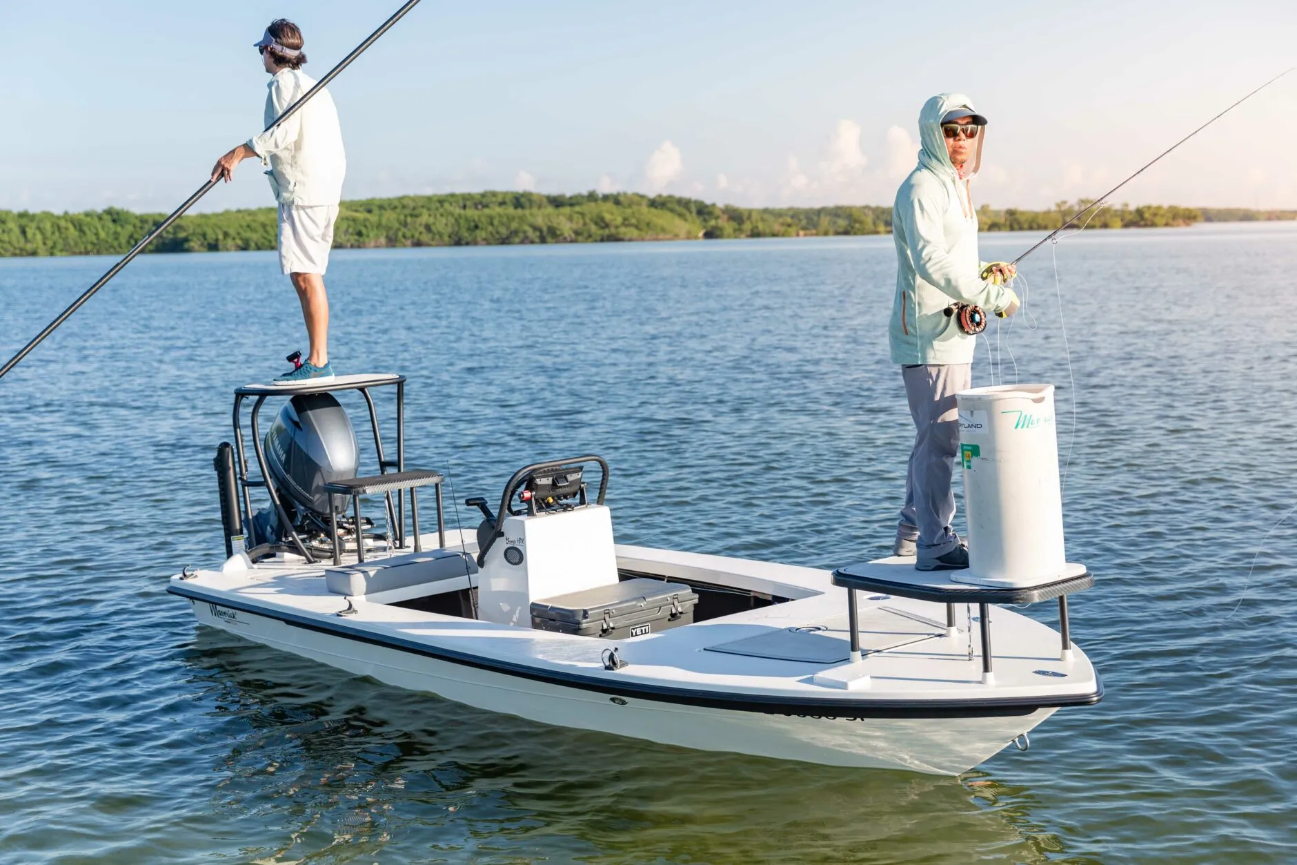 Inshore flats fishing boat on shallow tropical water