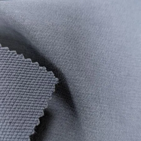 Performance stretch woven fabric with DWR finish for bowls outerwear