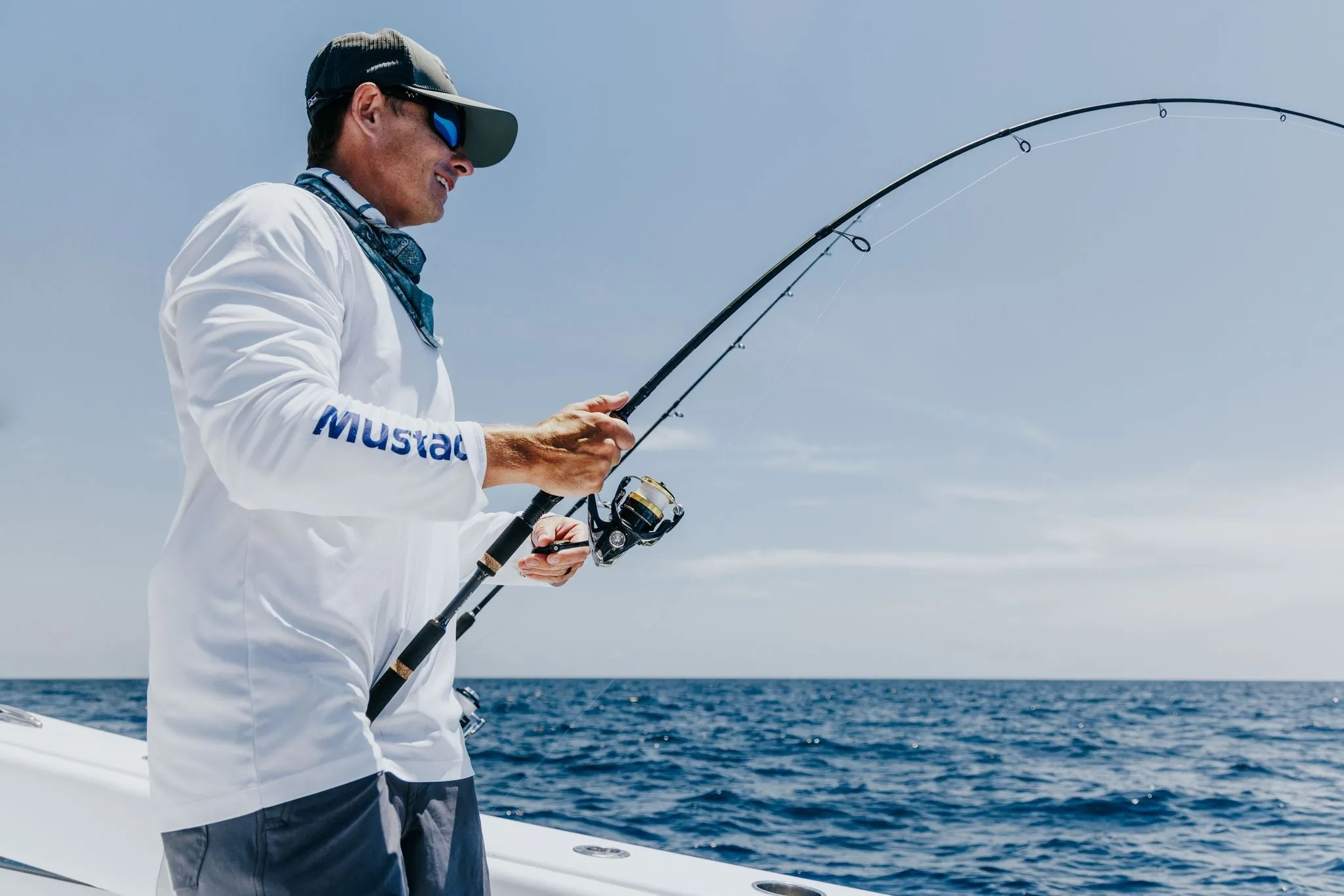 Fishing apparel collection display featuring performance fishing shirts and outdoor gear