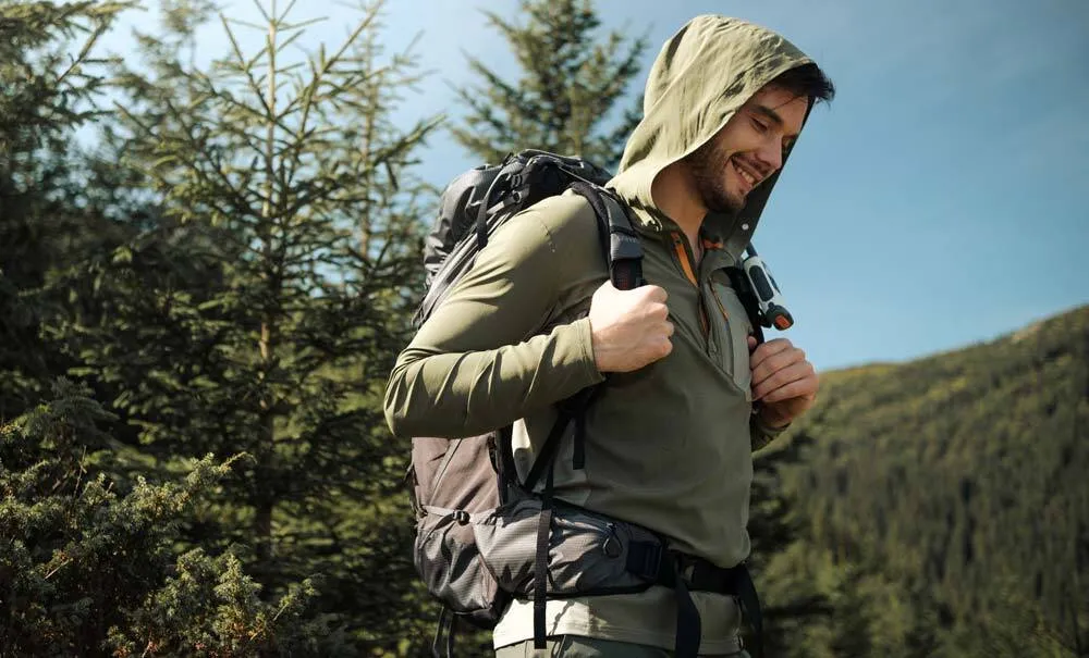 UPF sun protection hiking top on alpine ridge