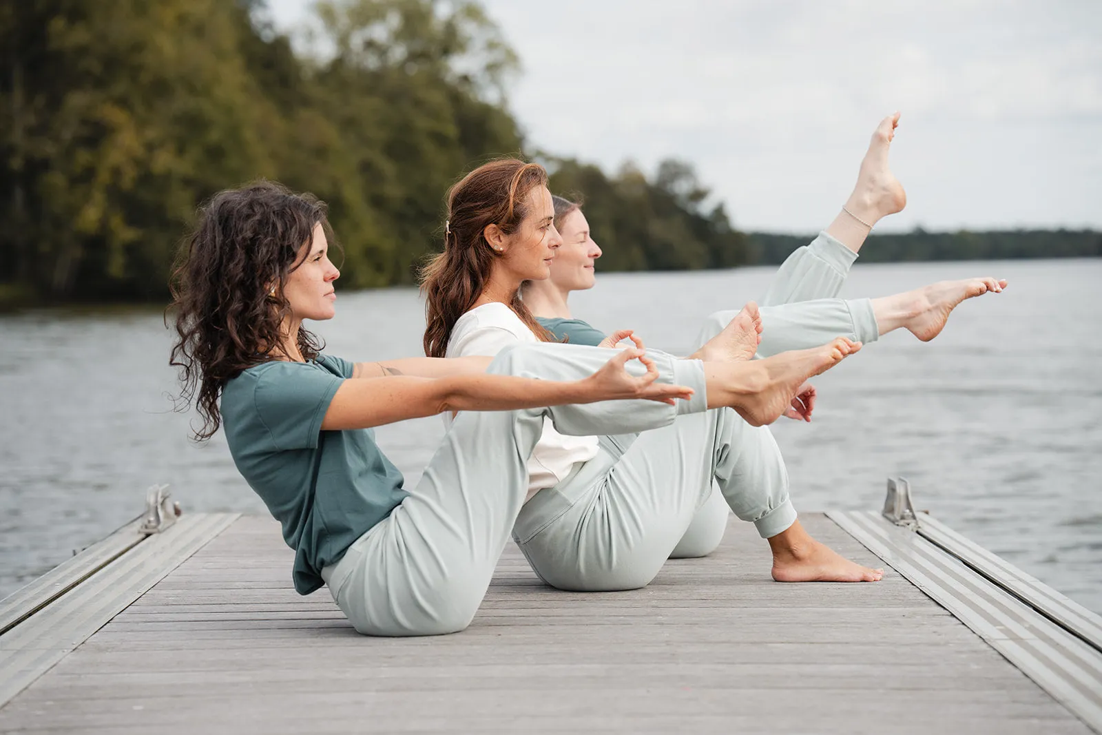 Professional yoga practitioner wearing custom eco-friendly yoga apparel set in a sunlit studio — representing LeelineWear's custom yoga wear manufacturing quality