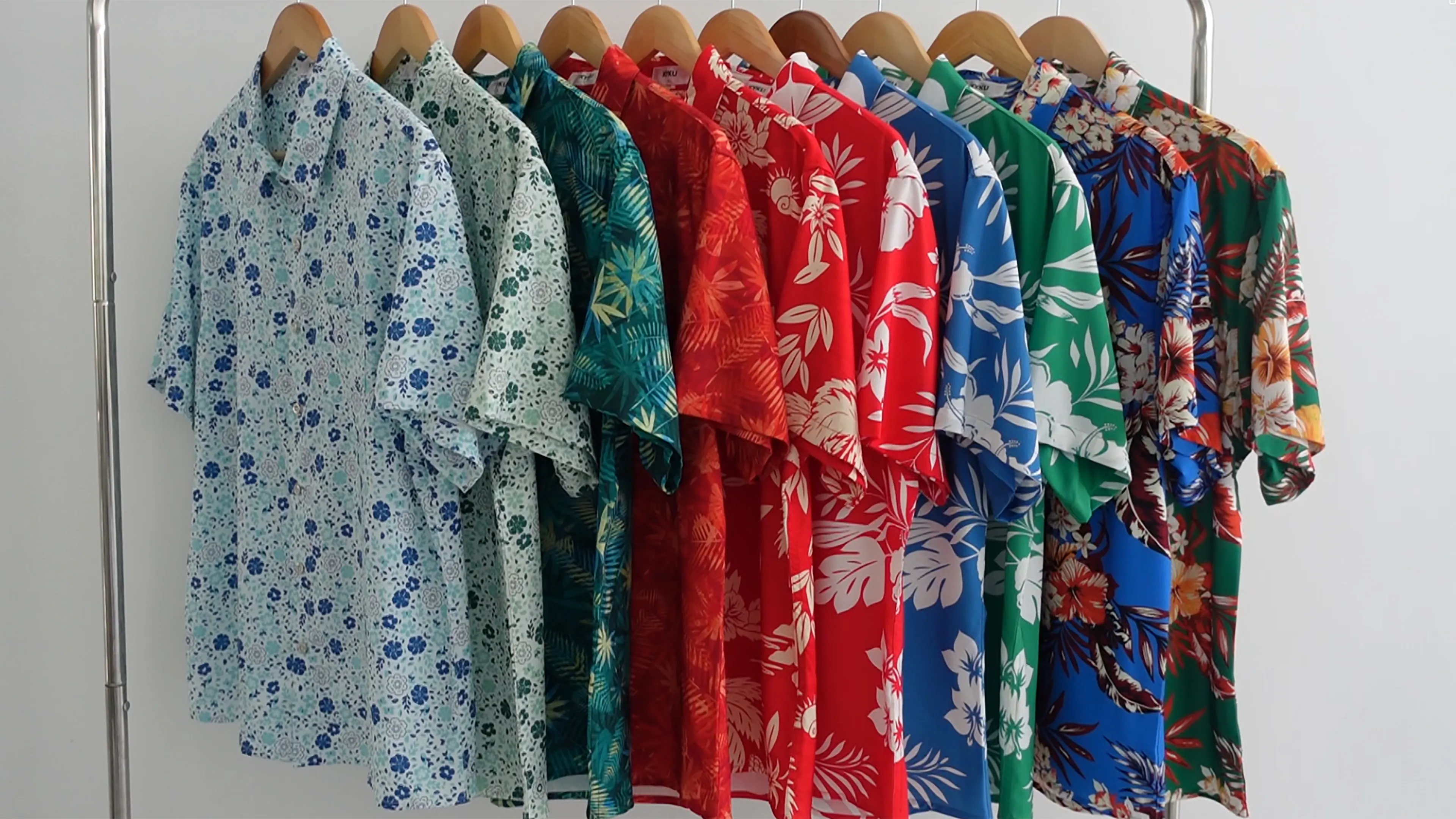Stack of custom Hawaiian shirts ready for bulk wholesale orders