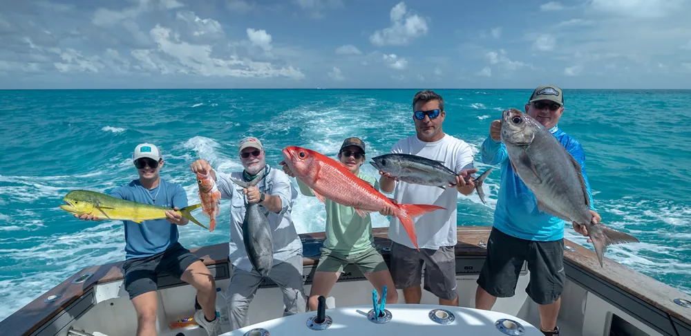 Deep sea fishing boat in open ocean with dramatic sky