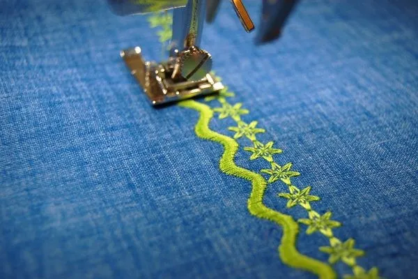 Close-up of embroidered logo on boxing robe with detailed stitching