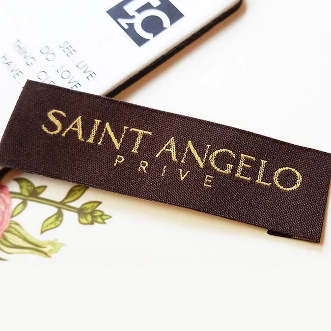 Custom woven neck label with outdoor brand logo — your label only, no mention of LeelineWear, for hunting apparel private label