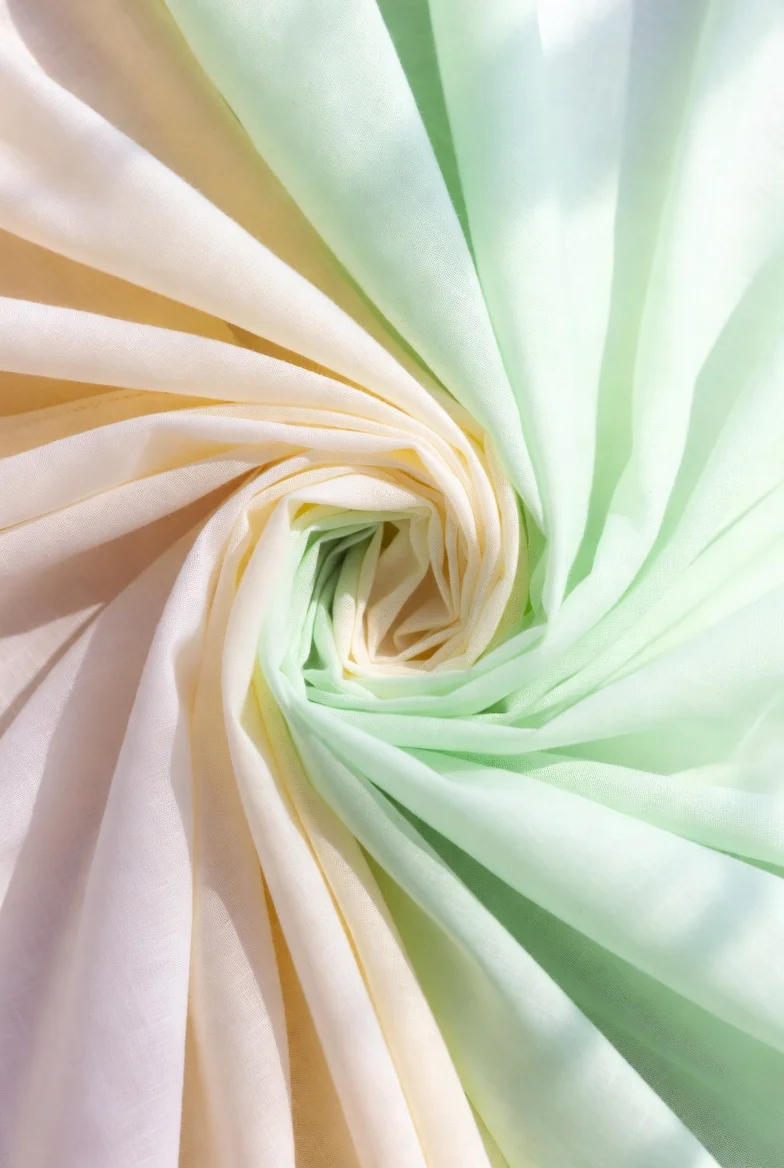 Lightweight cotton lawn fabric at 100–130 GSM for summer tees and tropical styles