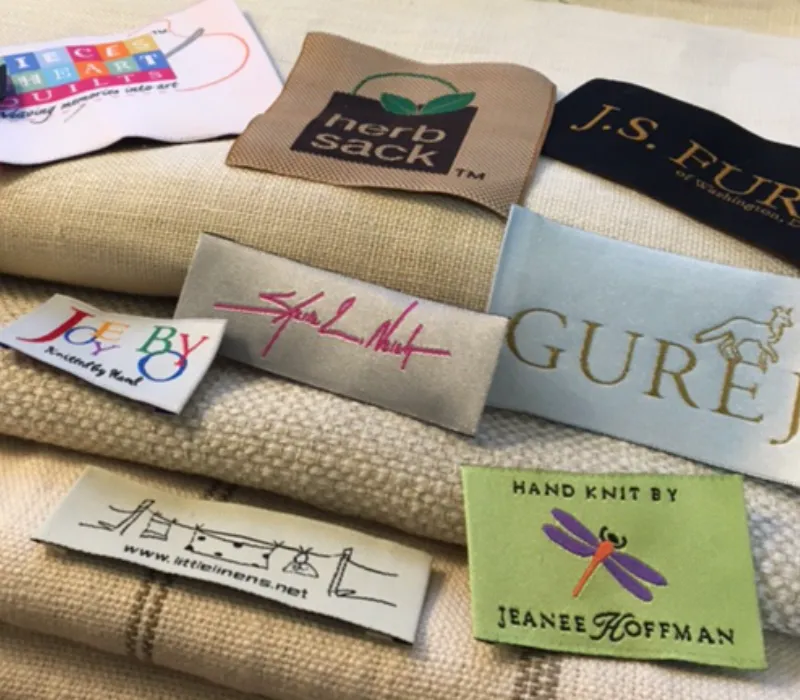 Custom woven labels with detailed brand logo and text for private label apparel