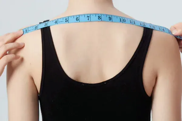 Shoulder width measurement for custom apparel size grading and fit