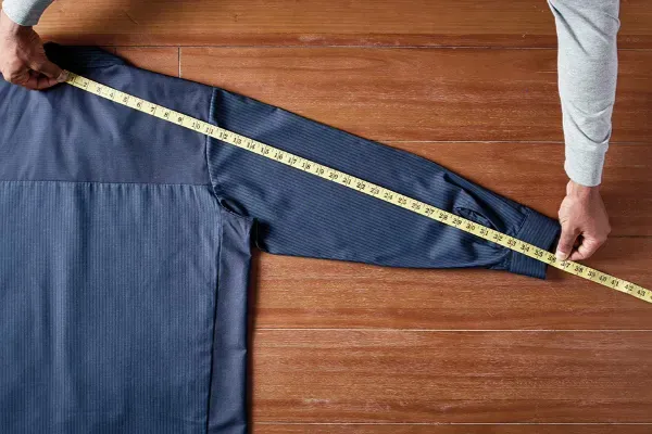 Sleeve length measurement technique for custom apparel production sizing