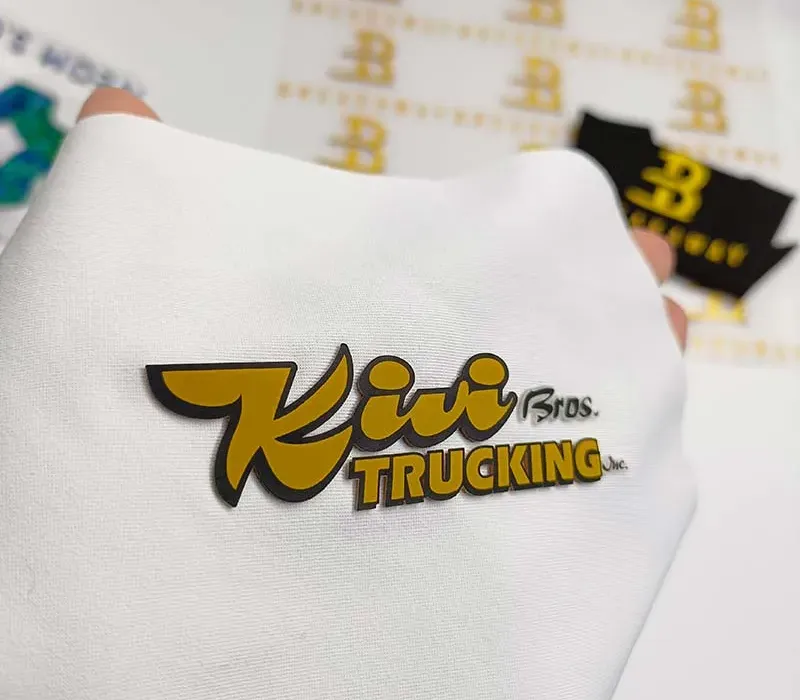 Heat transfer printed labels for tagless private label sportswear and activewear