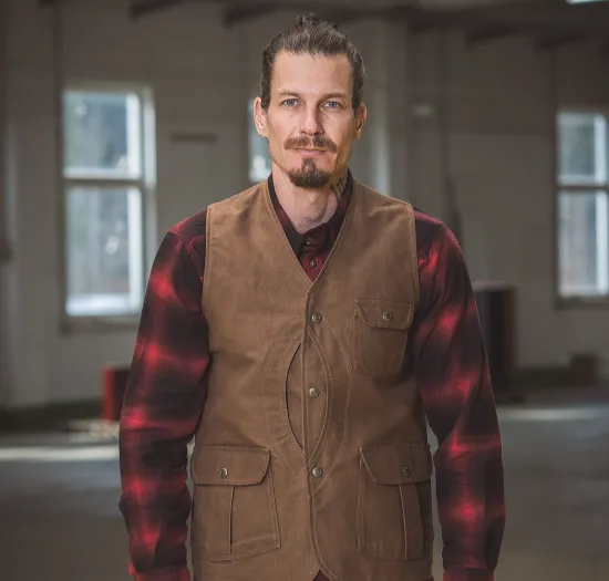 Custom hunting vest with multi-pocket storage and lightweight insulation — silent-access pocket design for upland and turkey hunters