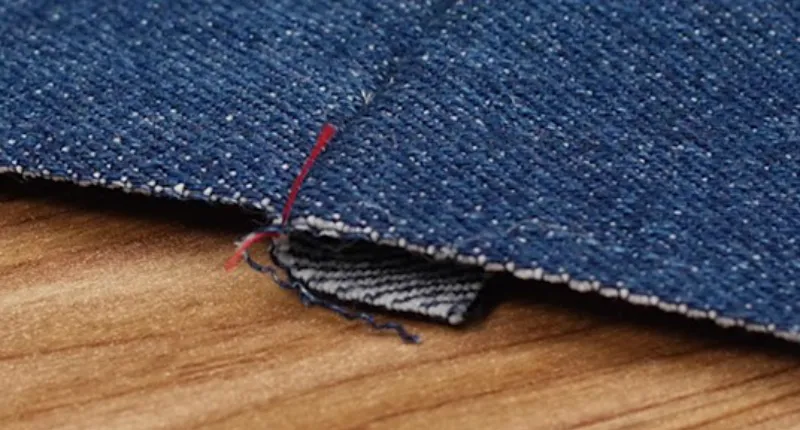 Provide clear defect definitions with macro-photo examples of dropped stitches or fabric pilling.